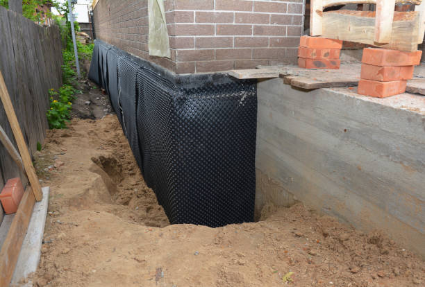 Happy homeowners after waterproofing job in Newaygo